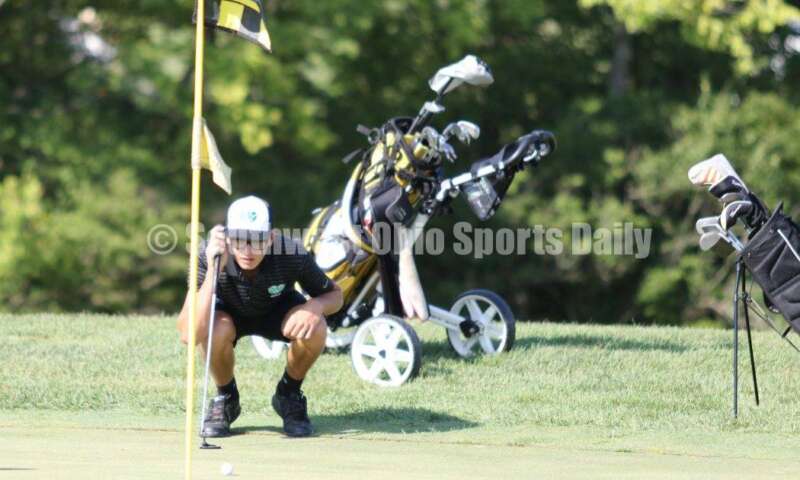 Badin High School's Andrew Larkin lines up a putt Aug. 15, 2019, during a dual golf match against Ross at Indian Ridge Golf Club. RICK CASSANO/STAFF
