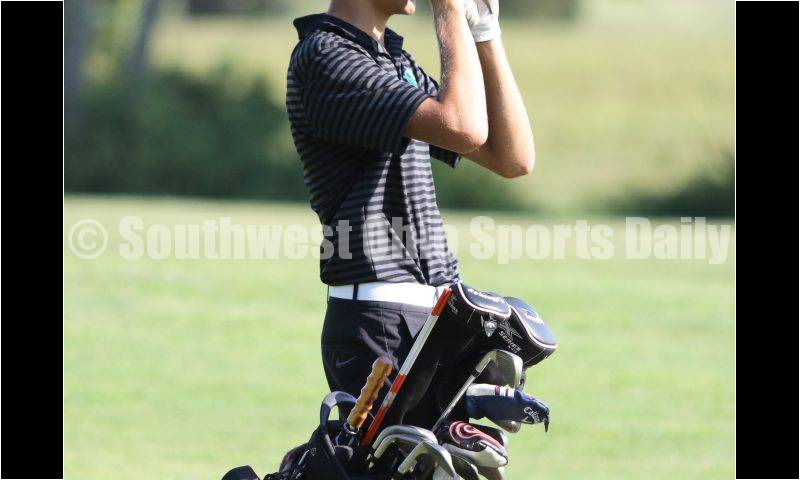Badin High School's Nick Young gets a closer look at the landscape in front of him Aug. 15, 2019, during a dual golf match against Ross at Indian Ridge Golf Club. RICK CASSANO/STAFF