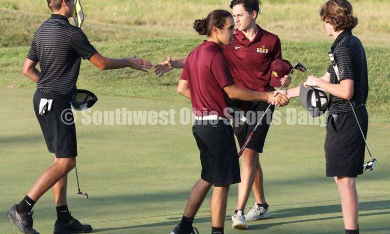 Badin High School's Andrew Larkin (left) and Kaiden Morris (far right) shake hands with Ben Hannon (middle left) and Nick Chernock of Ross after their round in a dual golf match Aug. 15, 2019, at Indian Ridge Golf Club. RICK CASSANO/STAFF