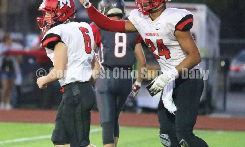 Madison High School's Quincy Brown (24) reacts after an extra point by Korbin Kilbarger (6) on Oct. 3, 2019, during a Southwestern Buckeye League football game at Dixie. The visiting Mohawks won 48-13. RICK CASSANO/STAFF