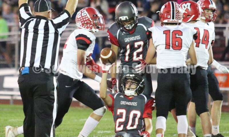 Dixie High School's Conner Hawk (20) is about to give the ball to an official Oct. 3, 2019, during a Southwestern Buckeye League football game against Madison at Dixie. The visiting Mohawks won 48-13. RICK CASSANO/STAFF