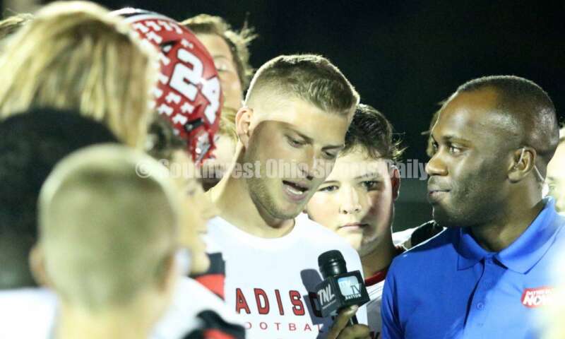 Madison High School coach Ricky Davis does a postgame interview Oct. 3, 2019, at a Southwestern Buckeye League football contest at Dixie. The visiting Mohawks won 48-13. RICK CASSANO/STAFF