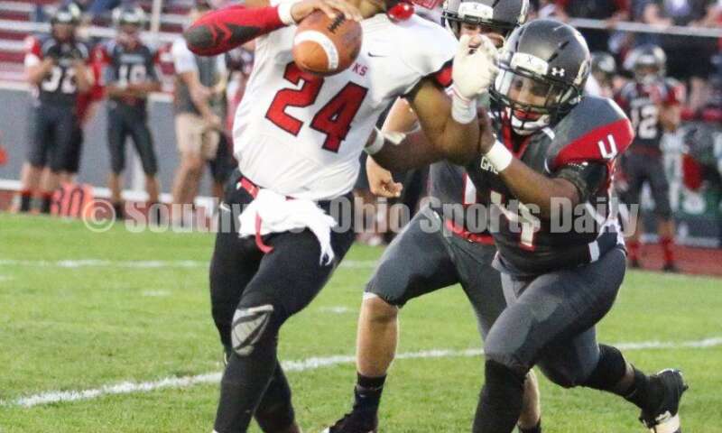 Madison High School's Quincy Brown (24) is chased on a conversion attempt Oct. 3, 2019, during a Southwestern Buckeye League football game at Dixie. The visiting Mohawks won 48-13. RICK CASSANO/STAFF