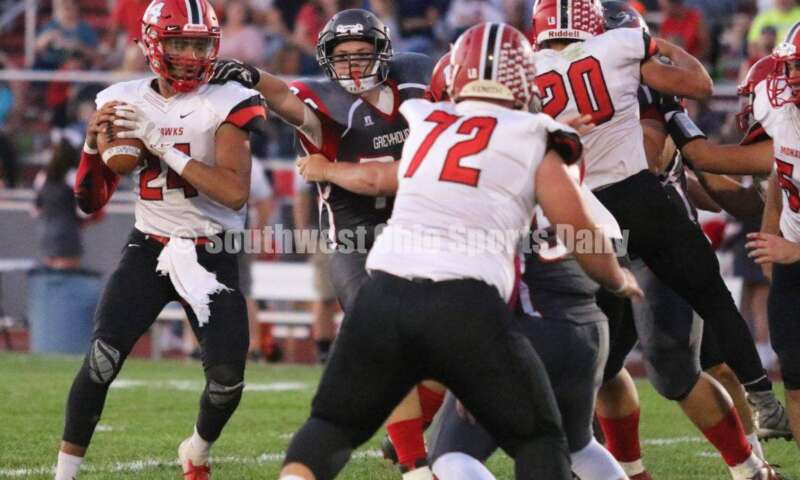 Madison High School quarterback Quincy Brown is under pressure Oct. 3, 2019, during a Southwestern Buckeye League football game at Dixie. The visiting Mohawks won 48-13. RICK CASSANO/STAFF