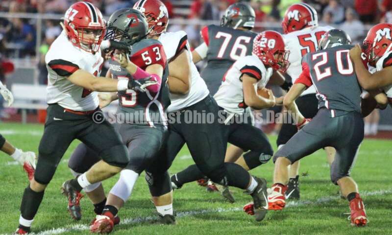 Madison High School's Logan Gibson carries the ball up the middle Oct. 3, 2019, during a Southwestern Buckeye League football game at Dixie. The visiting Mohawks won 48-13. RICK CASSANO/STAFF