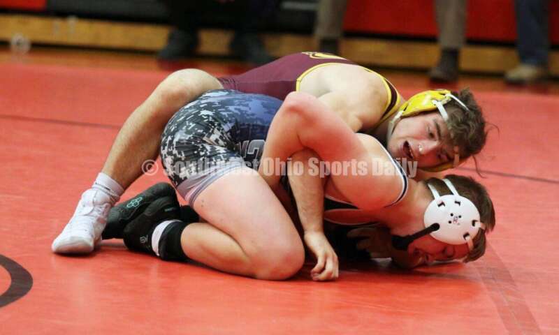Ross High School's Sean Beltran controls Blanchester's Gage Berwanger at 152 pounds Jan. 13, 2021, during a dual wrestling match at New Richmond. RICK CASSANO/STAFF