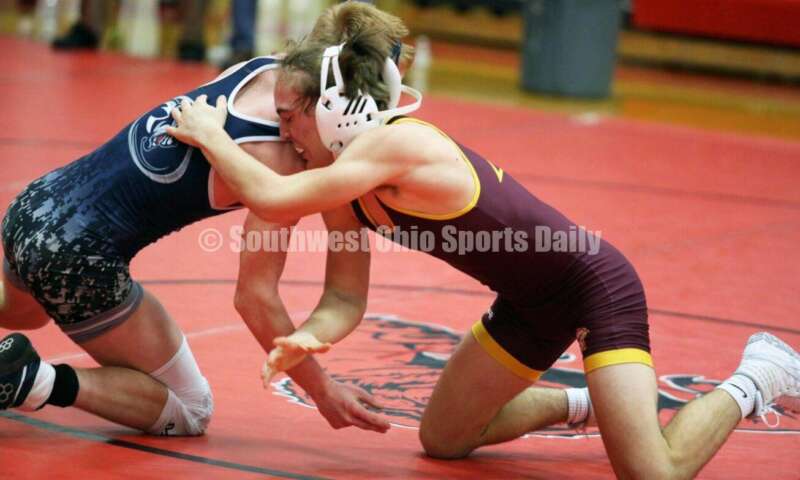 Ross High School's Ryan Foster (right) competes with Blanchester's Carson Curless at 132 pounds Jan. 13, 2021, during a dual wrestling match at New Richmond. RICK CASSANO/STAFF