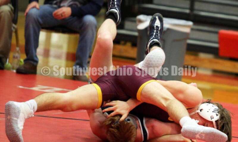 Ross High School's Ryan Foster is on top of Blanchester's Carson Curless at 132 pounds Jan. 13, 2021, during a dual wrestling match at New Richmond. RICK CASSANO/STAFF