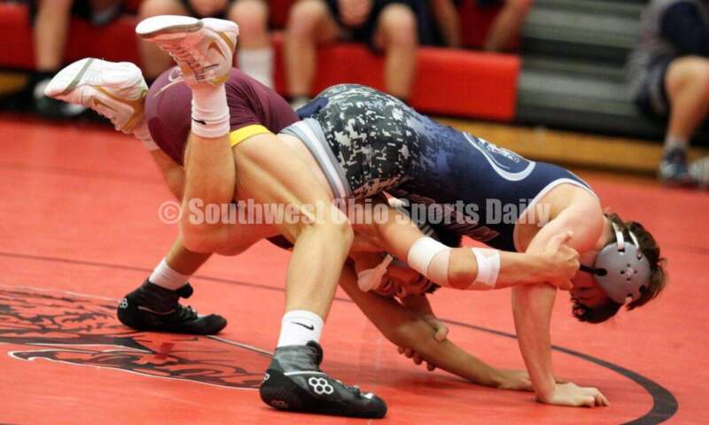 Ross High School's Jordan Miller (bottom) battles Blanchester's Jacob Hamm at 113 pounds Jan. 13, 2021, during a dual wrestling match at New Richmond. RICK CASSANO/STAFF
