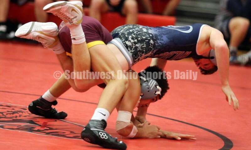 Ross High School's Jordan Miller (bottom) competes with Blanchester's Jacob Hamm at 113 pounds Jan. 13, 2021, during a dual wrestling match at New Richmond. RICK CASSANO/STAFF