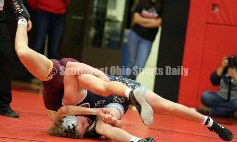Ross High School's Oliver Severance (left) battles Blanchester's Bryan Bandow at 145 pounds Jan. 13, 2021, during a dual wrestling match at New Richmond. RICK CASSANO/STAFF