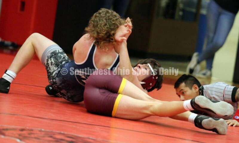 Ross High School's Oliver Severance (right) competes with Blanchester's Bryan Bandow at 145 pounds Jan. 13, 2021, during a dual wrestling match at New Richmond. RICK CASSANO/STAFF
