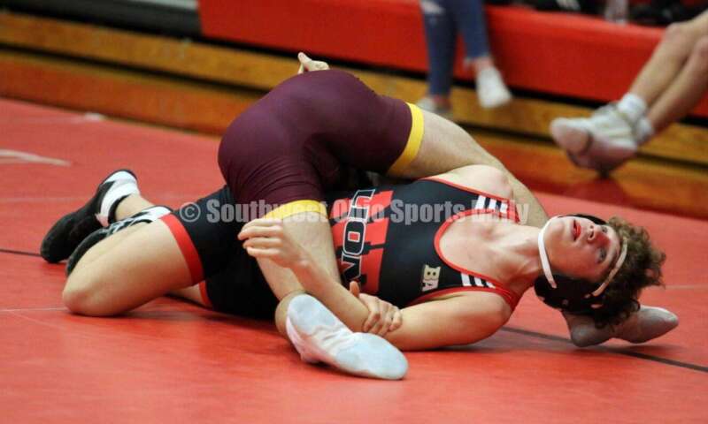 New Richmond High School's Griffin Ross (right) tries to escape the grip of Sean Beltran of Ross at 152 pounds Jan. 13, 2021, during a dual wrestling match at New Richmond. RICK CASSANO/STAFF