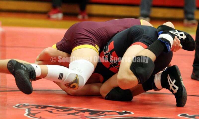 Ross High School's Jaiden Earls is on top of New Richmond's Lexington Hounshell at 120 pounds Jan. 13, 2021, during a dual wrestling match at New Richmond. RICK CASSANO/STAFF