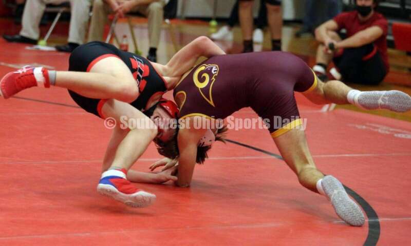 Ross High School's Ryan Foster (right) competes with New Richmond's Derrick Klinker at 132 pounds Jan. 13, 2021, during a dual wrestling match at New Richmond. RICK CASSANO/STAFF