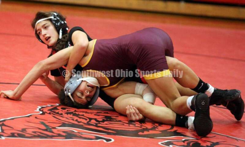 Ross High School's Jordan Miller (right) competes with New Richmond's Kaitlyn Fischer at 106 pounds Jan. 13, 2021, during a dual wrestling match at New Richmond. RICK CASSANO/STAFF