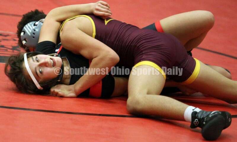 Ross High School's Jordan Miller controls New Richmond's Kaitlyn Fischer at 106 pounds Jan. 13, 2021, during a dual wrestling match at New Richmond. RICK CASSANO/STAFF
