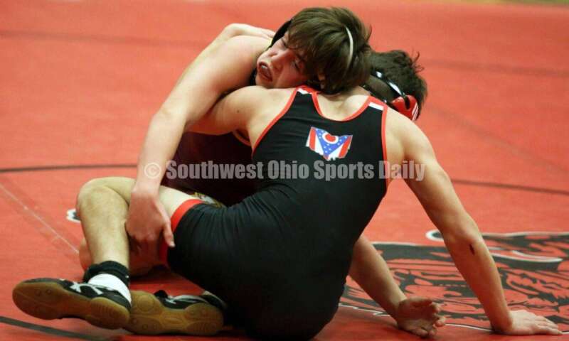 Ross High School's Austin Parker (left) competes with New Richmond's Zachary Rostetter at 126 pounds Jan. 13, 2021, during a dual wrestling match at New Richmond. RICK CASSANO/STAFF