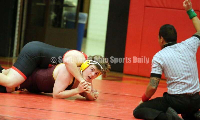 Ross High School's Matt Roach looks up while being held by New Richmond's Charles Miller at 195 pounds Jan. 13, 2021, during a dual wrestling match at New Richmond. RICK CASSANO/STAFF