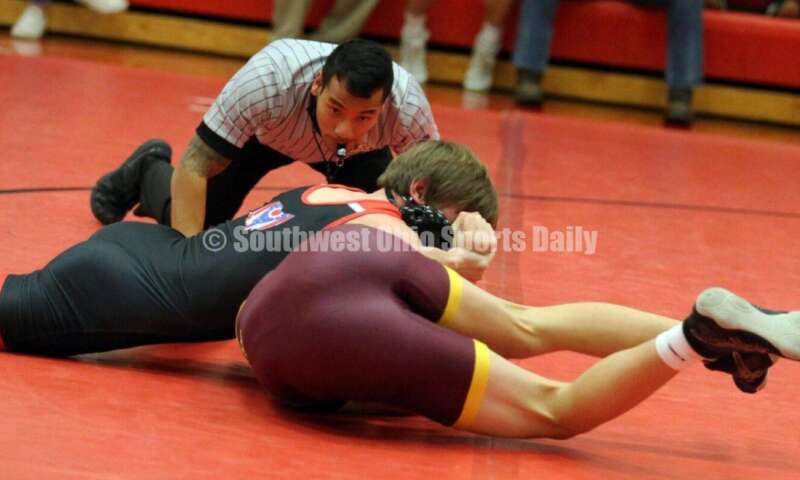 New Richmond High School's Sam Rostetter is on top of Oliver Severance of Ross at 138 pounds Jan. 13, 2021, during a dual wrestling match at New Richmond. RICK CASSANO/STAFF