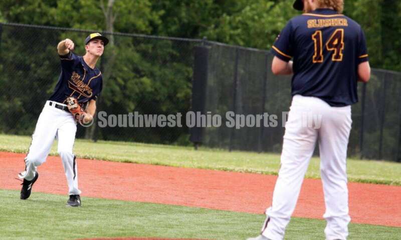 Badin High School's Ben Marischen makes a warmup throw to first base for Sluggers Baseball Club on June 25, 2021, during Pastime Tournaments' Ohio Valley 17U/18U Wood Bat Classic at New Richmond. The Sluggers lost to the Cincinnati Impact 3-2. RICK CASSANO/STAFF