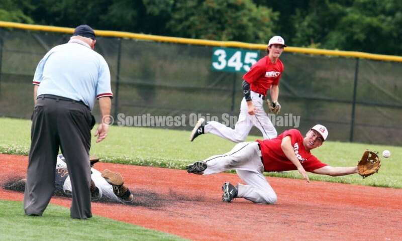 Lakota East High School's Will Becker reaches for a throw for the Cincinnati Impact as Edgewood's Jake Lange slides into second base for Sluggers Baseball Club on June 25, 2021, during Pastime Tournaments' Ohio Valley 17U/18U Wood Bat Classic at New Richmond. The Impact won 3-2. RICK CASSANO/STAFF