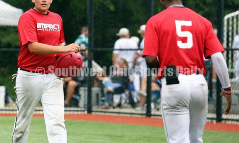 Lakota West High School's Colin Harrington walks toward the dugout after scoring a run for the Cincinnati Impact on June 25, 2021, during Pastime Tournaments' Ohio Valley 17U/18U Wood Bat Classic at New Richmond. The Impact beat Sluggers Baseball Club 3-2. RICK CASSANO/STAFF