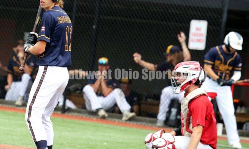 Badin High School's Mark Holderbach looks up the third-base line for Sluggers Baseball Club on June 25, 2021, during Pastime Tournaments' Ohio Valley 17U/18U Wood Bat Classic at New Richmond. The Sluggers lost to the Cincinnati Impact 3-2. RICK CASSANO/STAFF