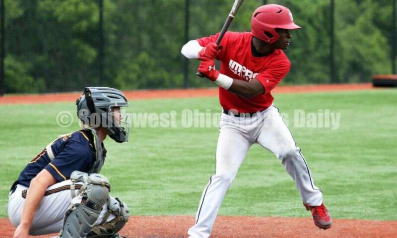 Lakota West High School's Adrian Davis loads up at the plate for the Cincinnati Impact on June 25, 2021, during Pastime Tournaments' Ohio Valley 17U/18U Wood Bat Classic at New Richmond. The Impact beat Sluggers Baseball Club 3-2. RICK CASSANO/STAFF