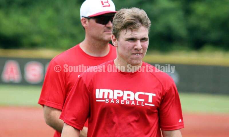 Lakota East High School's Will Becker comes to the dugout for the Cincinnati Impact on June 25, 2021, during Pastime Tournaments' Ohio Valley 17U/18U Wood Bat Classic at New Richmond. The Impact beat Sluggers Baseball Club 3-2. RICK CASSANO/STAFF