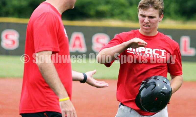 Lakota East High School's Will Becker comes to the dugout for the Cincinnati Impact on June 25, 2021, during Pastime Tournaments' Ohio Valley 17U/18U Wood Bat Classic at New Richmond. The Impact beat Sluggers Baseball Club 3-2. RICK CASSANO/STAFF