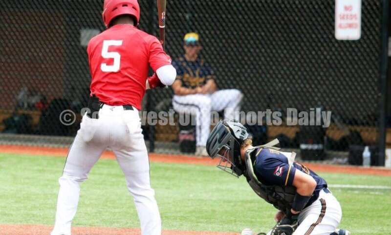 Lakota West High School's Adrian Davis (5) is at the plate for the Cincinnati Impact as Edgewood's Jesse Thompson blocks a pitch for Sluggers Baseball Club on June 25, 2021, during Pastime Tournaments' Ohio Valley 17U/18U Wood Bat Classic at New Richmond. The Impact won 3-2. RICK CASSANO/STAFF
