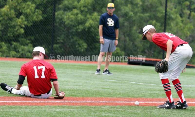 Lakota West High School's Ethan Vaught (19) and Connor Crowley (17) eye a bunt for the Cincinnati Impact on June 25, 2021, during Pastime Tournaments' Ohio Valley 17U/18U Wood Bat Classic at New Richmond. The Impact beat Sluggers Baseball Club 3-2. RICK CASSANO/STAFF