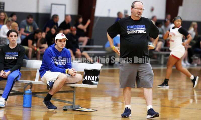 Milford High School coach Matt Tolliver watches from the sideline July 10, 2021, during the Cincy Chargers' game against the Maryland Blazers in a matchup of 17-year-old girls basketball teams in the USJN's Midwest Summer Challenge at Sports Plus in Evendale. The Chargers won 58-31. RICK CASSANO/STAFF