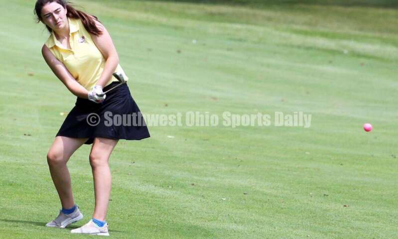 Fenwick High School's Maggie Kurtz watches her shot Aug. 6, 2021, during a Greater Catholic League Coed Division girls golf match against Dayton Carroll at Brown's Run Country Club. Fenwick won 172-188. RICK CASSANO/STAFF