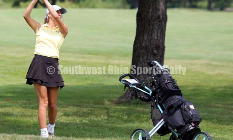 Fenwick High School's Jocelyn Wright watches her shot Aug. 6, 2021, during a Greater Catholic League Coed Division girls golf match against Dayton Carroll at Brown's Run Country Club. Fenwick won 172-188. RICK CASSANO/STAFF