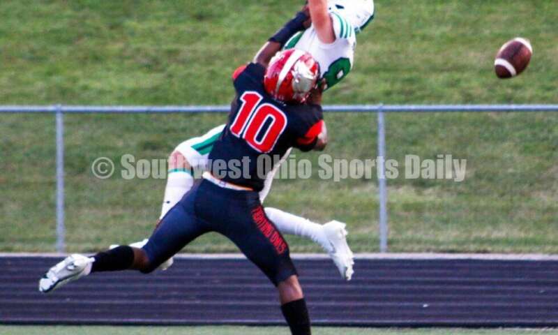 Badin High School's Eric Rawlings can't come down with the ball, but Mount Healthy's Ja'Mier Scott (10) was called for pass interference Aug. 20, 2021, during a nonleague football game at Mount Healthy. Badin won 27-7. CONTRIBUTED PHOTO BY JON SEPCHINSKI