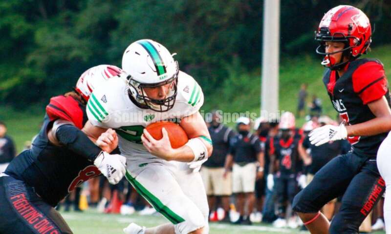 Badin High School's Jack Walsh weaves throught the Mount Healthy defense for a touchdown Aug. 20, 2021, during a nonleague football battle at Mount Healthy. Badin won 27-7. CONTRIBUTED PHOTO BY JON SEPCHINSKI