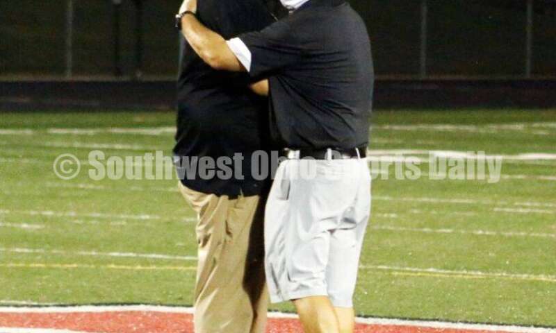 Badin High School coach Nick Yordy (right) meets with Arvie Crouch, his Mount Healthy counterpart, after Badin's 27-7 nonleague football win Aug. 20, 2021, at Mount Healthy. CONTRIBUTED PHOTO BY JON SEPCHINSKI
