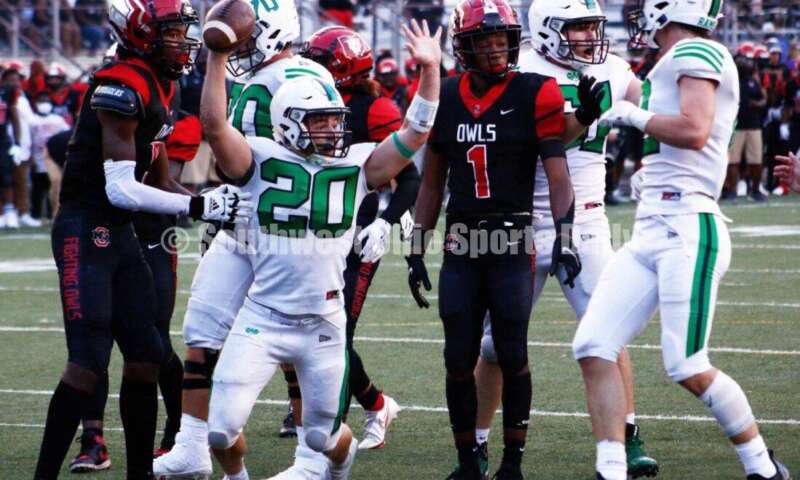 Badin High School's Jack Walsh (20) celebrates a touchdown Aug. 20, 2021, during a nonleague football game at Mount Healthy. Badin won 27-7. CONTRIBUTED PHOTO BY JON SEPCHINSKI