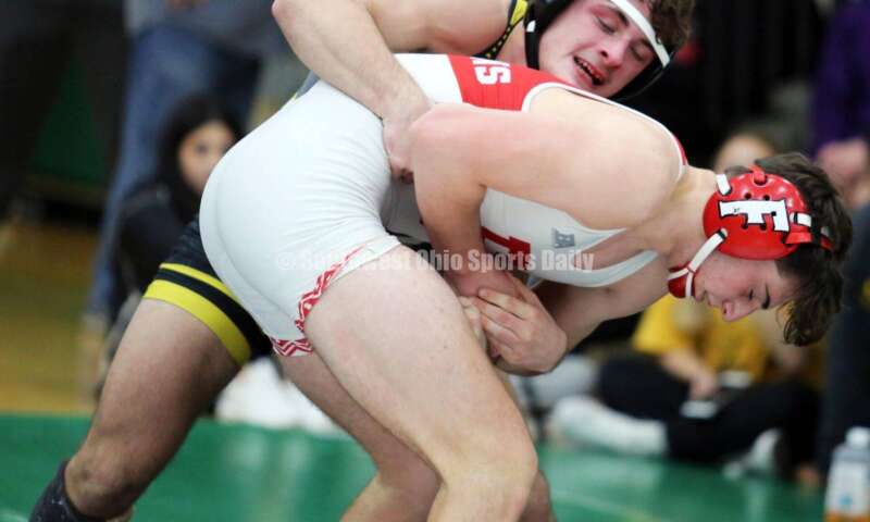 Centerville High School's Aydan George grabs Fairfield's Lane Abrams in a 165-pound match Dec. 19, 2021, during the Southwest Ohio Wrestling Coaches Association Coaches Classic at Harrison High School. RICK CASSANO/STAFF