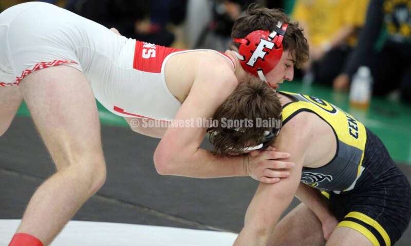 Fairfield High School's Lane Abrams (left) battles Centerville's Aydan George in a 165-pound match Dec. 19, 2021, during the Southwest Ohio Wrestling Coaches Association Coaches Classic at Harrison High School. RICK CASSANO/STAFF