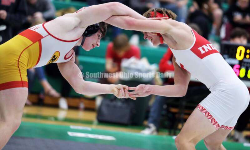 Fairfield High School's Tannar Beermann (right) gets locked up with Brecksville's Manny Scordos in a 144-pound match Dec. 19, 2021, during the Southwest Ohio Wrestling Coaches Association Coaches Classic at Harrison High School. RICK CASSANO/STAFF