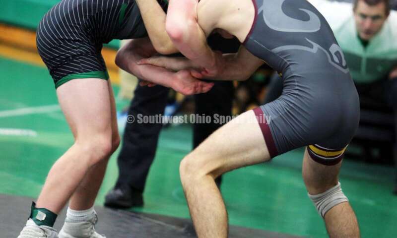 Ross High School's Ryan Foster (right) grapples with Harrison's Maddox Carter in a 138-pound match Dec. 19, 2021, during the Southwest Ohio Wrestling Coaches Association Coaches Classic at Harrison High School. RICK CASSANO/STAFF