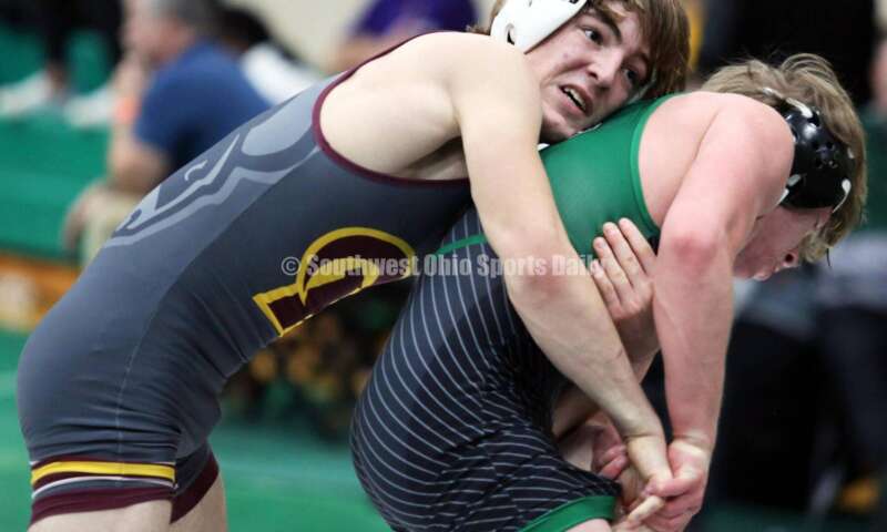 Ross High School's Ryan Foster (left) controls Harrison's Maddox Carter in a 138-pound match Dec. 19, 2021, during the Southwest Ohio Wrestling Coaches Association Coaches Classic at Harrison High School. RICK CASSANO/STAFF