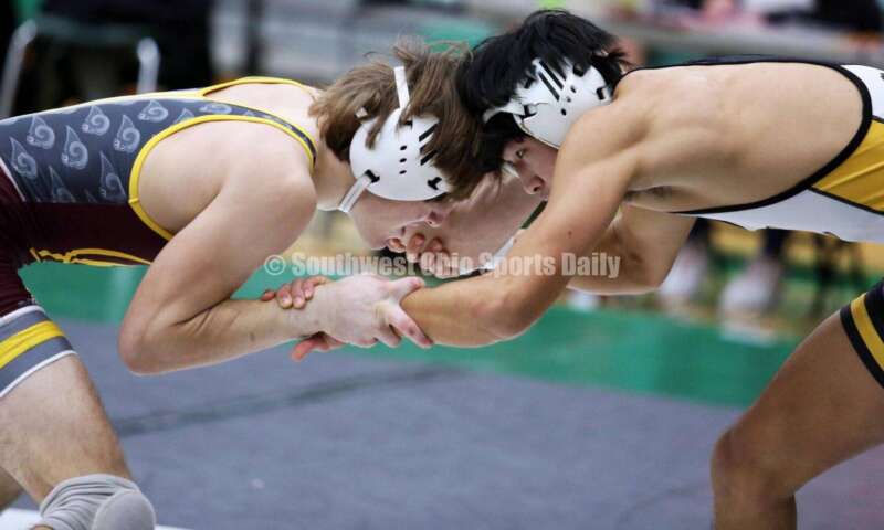 Ross High School's Ryan Foster (left) and Centerville's Spencer Meng square off in a 138-pound match Dec. 19, 2021, during the Southwest Ohio Wrestling Coaches Association Coaches Classic at Harrison High School. RICK CASSANO/STAFF