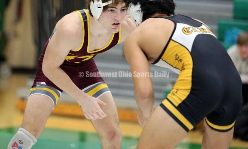 Ross High School's Ryan Foster (left) and Centerville's Spencer Meng compete in a 138-pound match Dec. 19, 2021, during the Southwest Ohio Wrestling Coaches Association Coaches Classic at Harrison High School. RICK CASSANO/STAFF