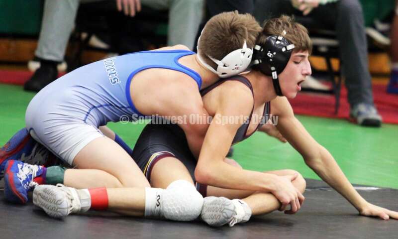 Ross High School's Jovanni Greco (right) battles Jonah McCloskey of Simon Kenton (Ky.) in a 113-pound match Dec. 19, 2021, during the Southwest Ohio Wrestling Coaches Association Coaches Classic at Harrison High School. RICK CASSANO/STAFF