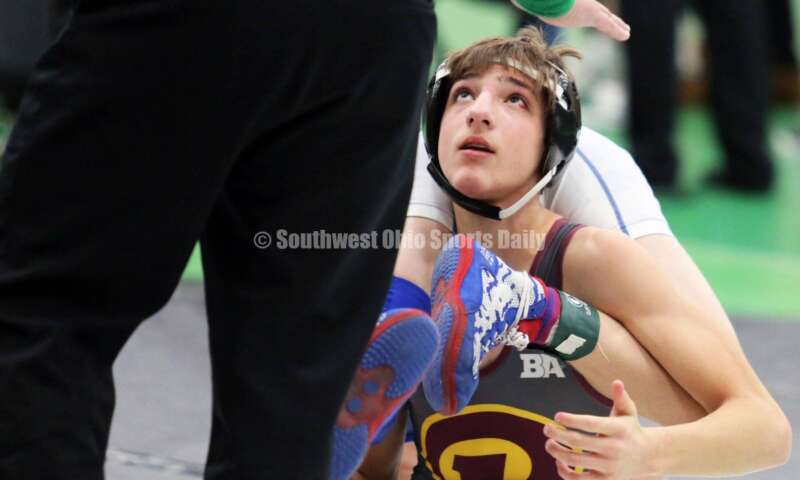 Ross High School's Jovanni Greco eyes an official in a 113-pound match against Jonah McCloskey of Simon Kenton (Ky.) on Dec. 19, 2021, during the Southwest Ohio Wrestling Coaches Association Coaches Classic at Harrison High School. RICK CASSANO/STAFF