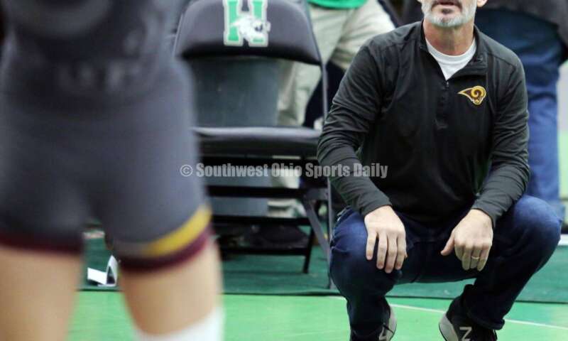 Ross High School coach Rich Dunn gives instructions to Jovanni Greco in his 113-pound match against Jonah McCloskey of Simon Kenton (Ky.) on Dec. 19, 2021, during the Southwest Ohio Wrestling Coaches Association Coaches Classic at Harrison High School. RICK CASSANO/STAFF